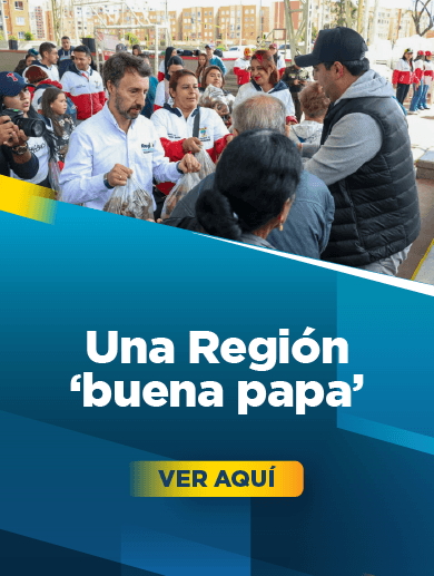 banner muestra al director de la Región Metropolitana Bogotá Cundinamarca entregando papa a personas que asistieron a jornada de entrega de papa a la comunidades vulnerables de Soacha